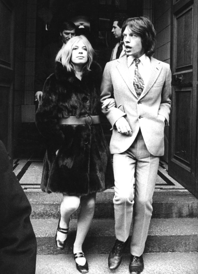 Mick Jagger and Marianne Faithfull leaving a building.