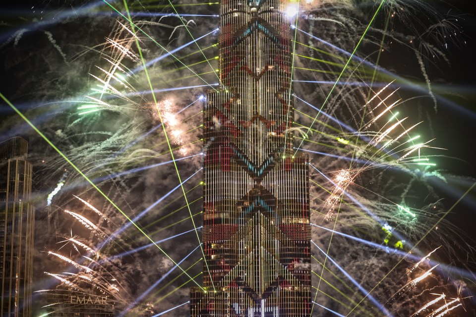 Fireworks exploding around the Burj Khalifa.