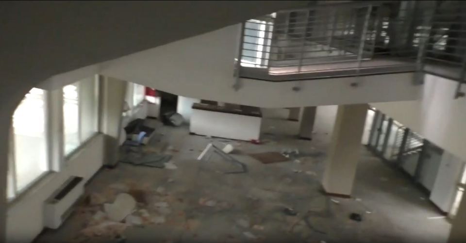 Interior of abandoned Stadio Flaminio in Rome, showing debris and damage.