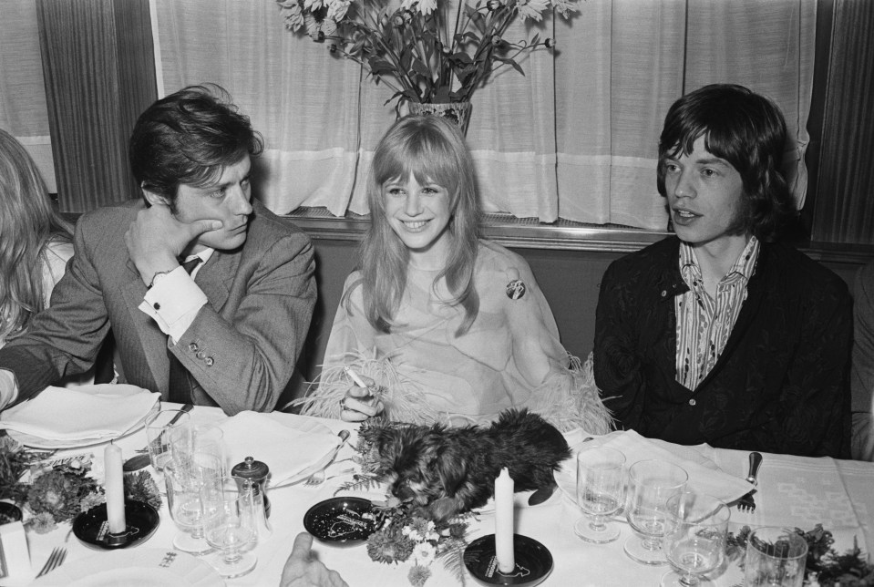 Alain Delon, Marianne Faithfull, and Mick Jagger at a meeting with film director Jack Cardiff.