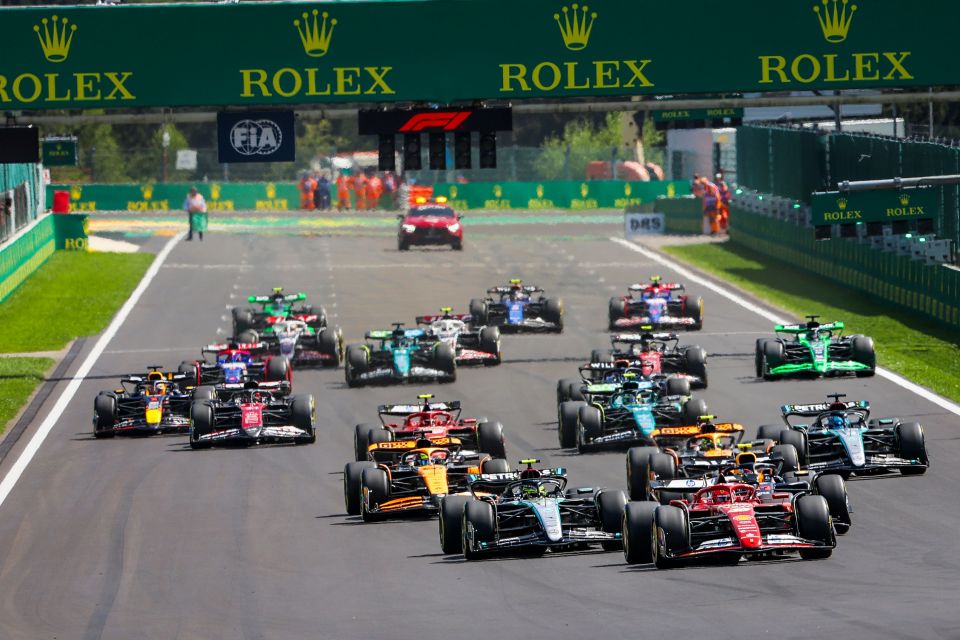 Formula 1 race cars at the start of a race.