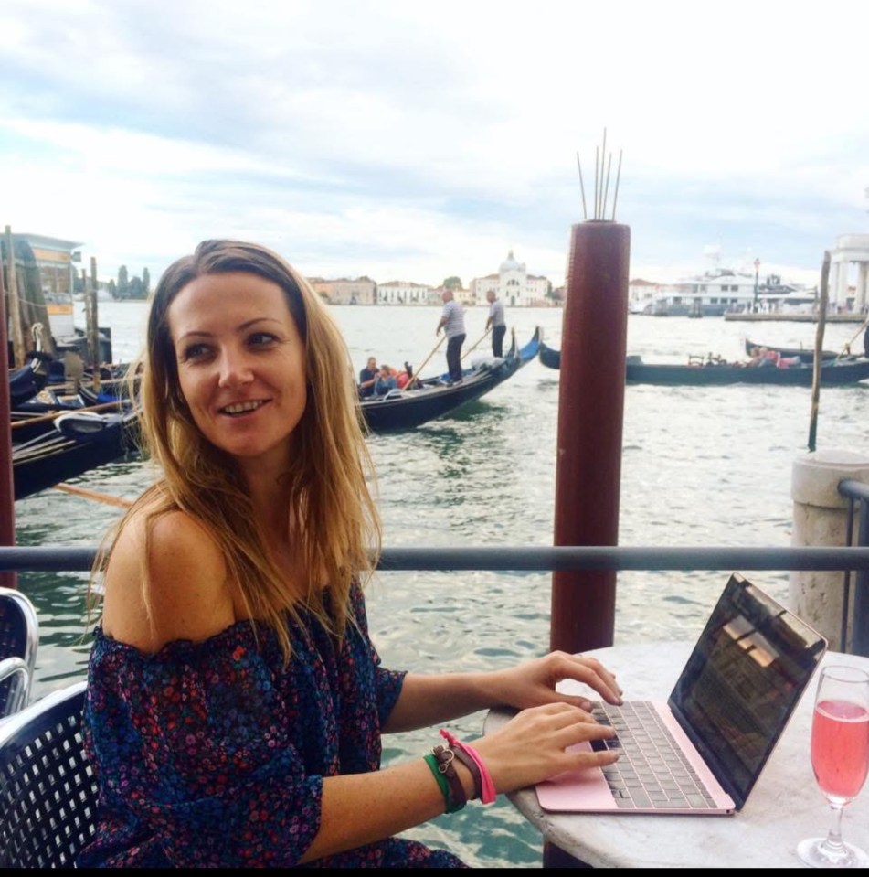Woman working on laptop in Venice.