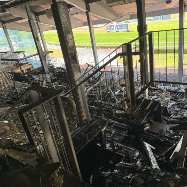 Fire damage to a racetrack's interior.