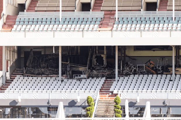 Fire damage inside a stadium.