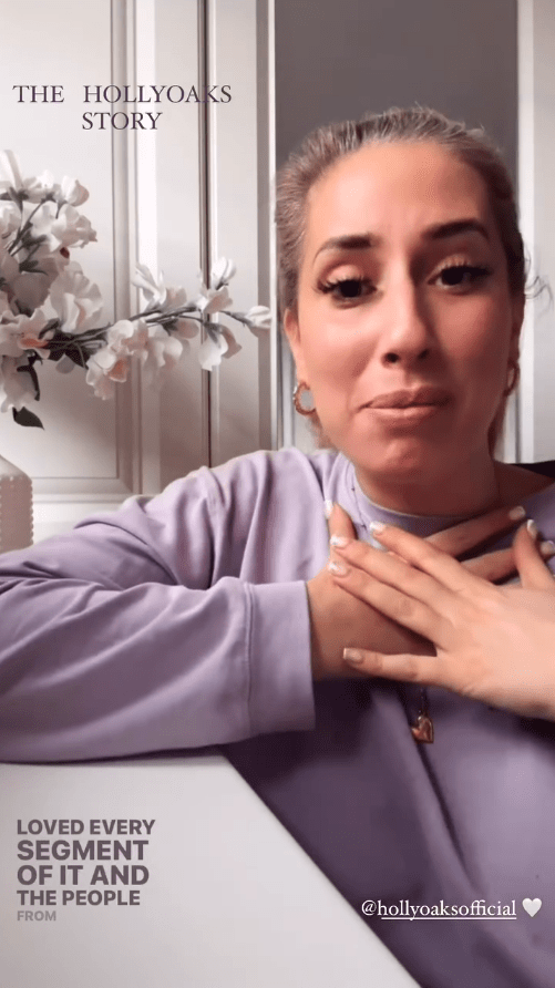 Woman in lavender sweater expressing gratitude.
