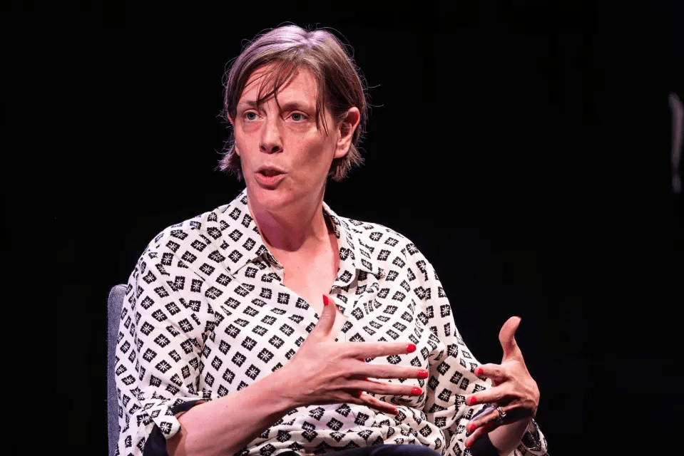 Woman speaking at an event.