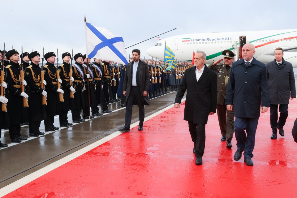 Iranian President Masoud Pezeshkian arriving in Moscow, greeted by Russian officials.