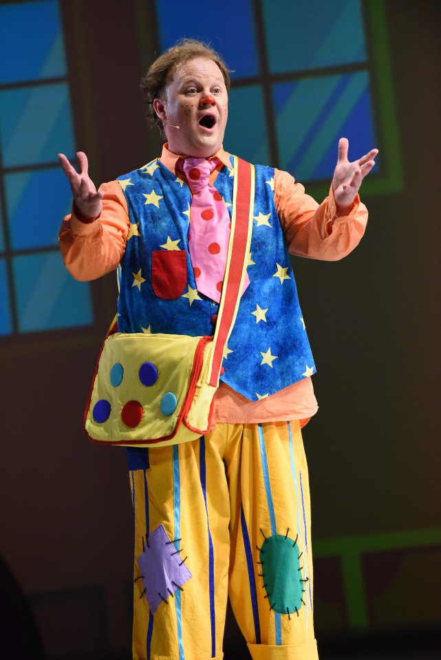 Justin Fletcher as Mr. Tumble in a theatrical production.