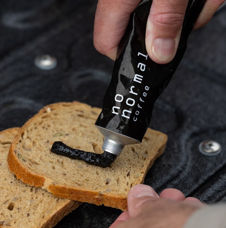 Coffee paste being spread on bread.