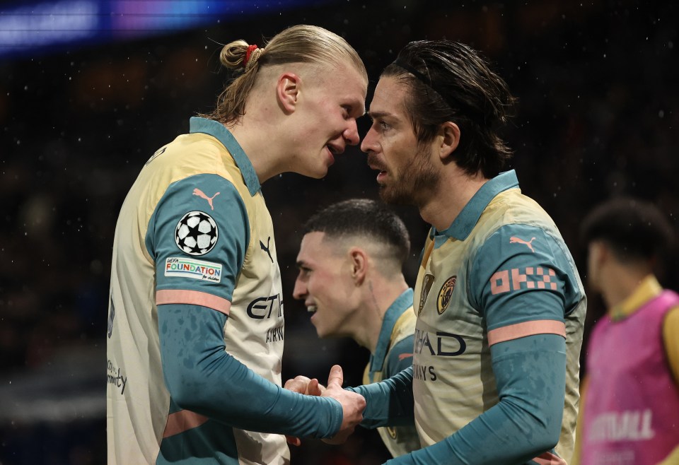 Erling Haaland and Jack Grealish of Manchester City celebrating after a goal.