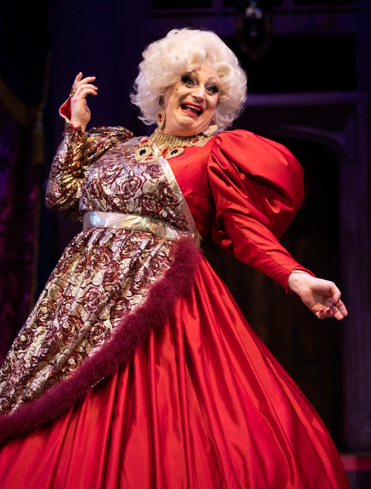 Myra Dubois in a red gown at the Death Drop press call.