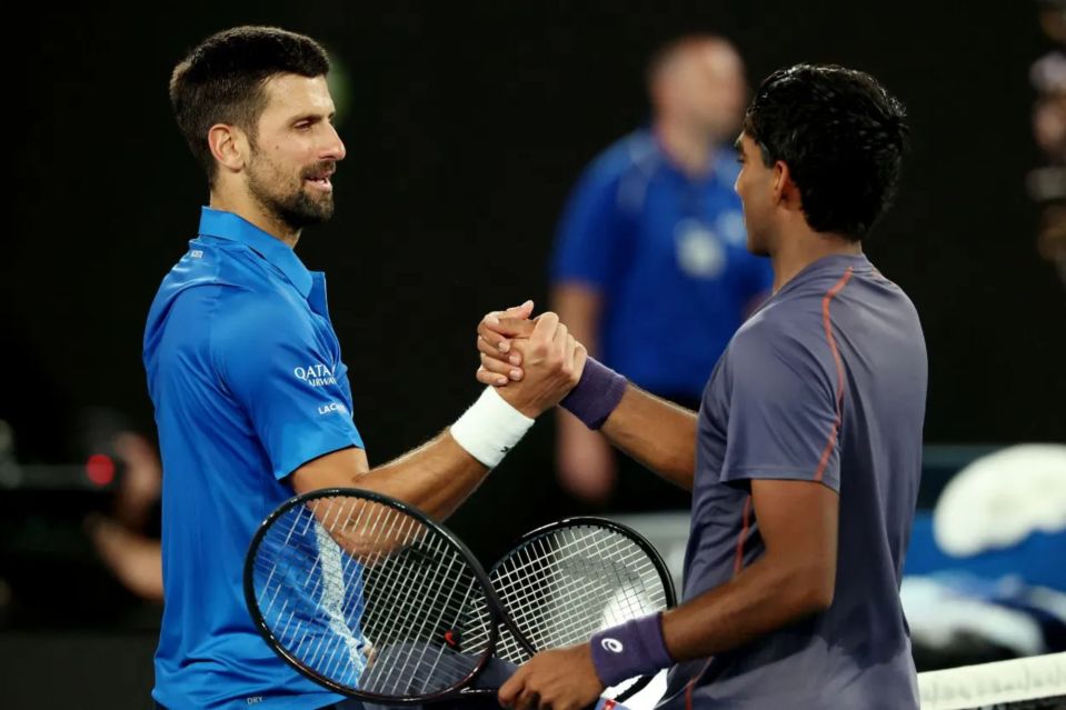 Novak Djokovic and his opponent shaking hands after a tennis match.