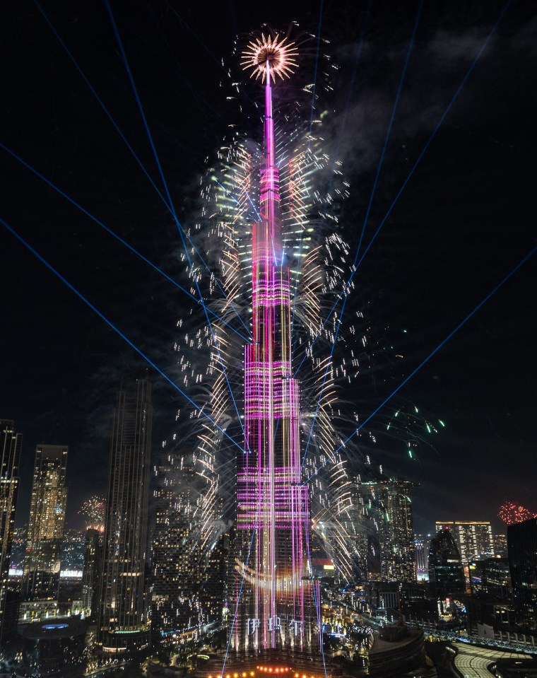 Fireworks exploding around the Burj Khalifa.