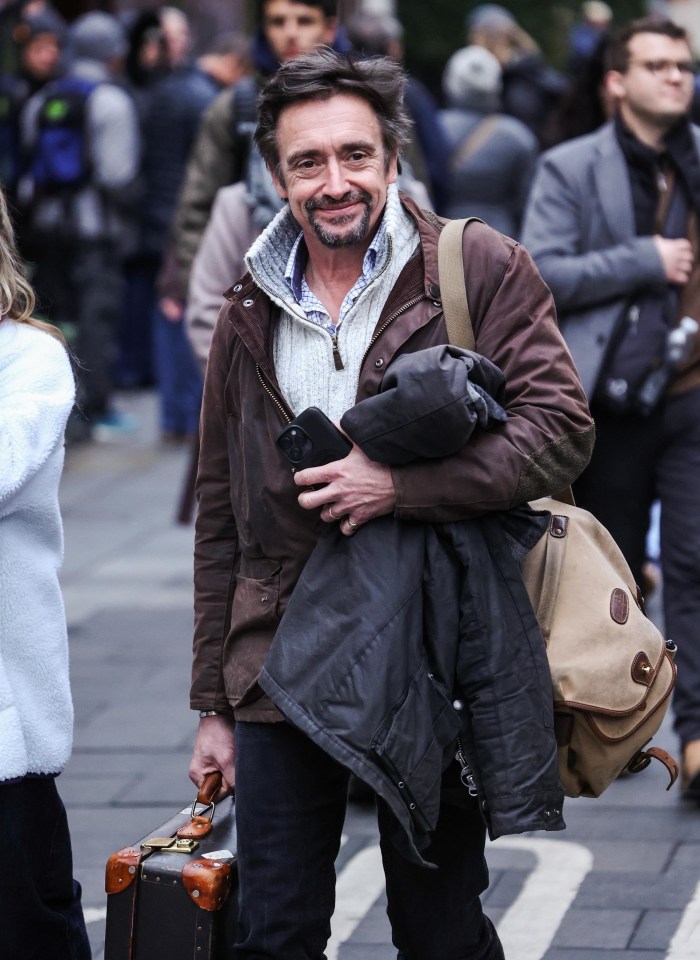 Richard Hammond carrying a suitcase and wearing a wedding ring.