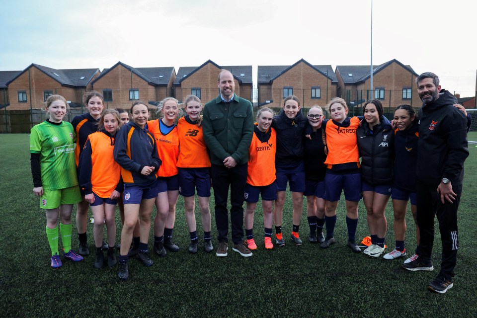 Prince William with a group of young people.