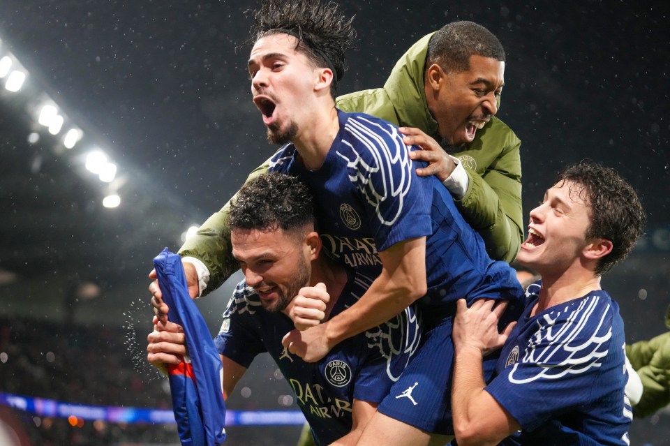 Goncalo Ramos of PSG celebrates a goal with teammates.