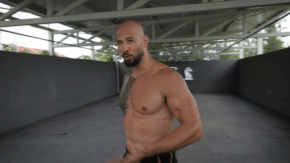 Andrew Tate walking outdoors.