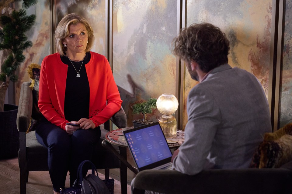 Leanne Battersby looking at Rowan's laptop.