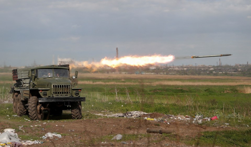 BM-21 Grad multiple rocket launcher firing a rocket.