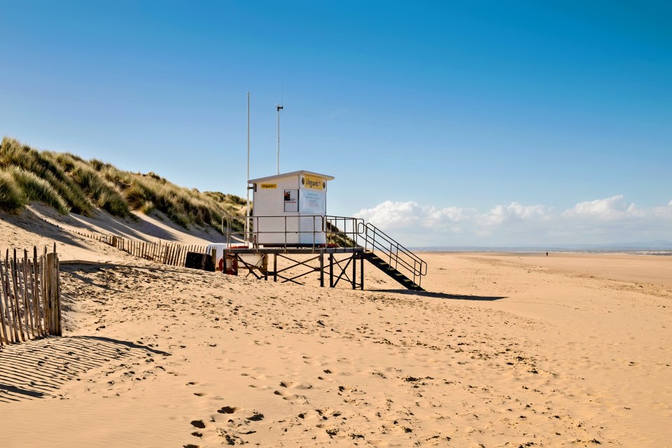 Lifeguard station on a sandy beach.