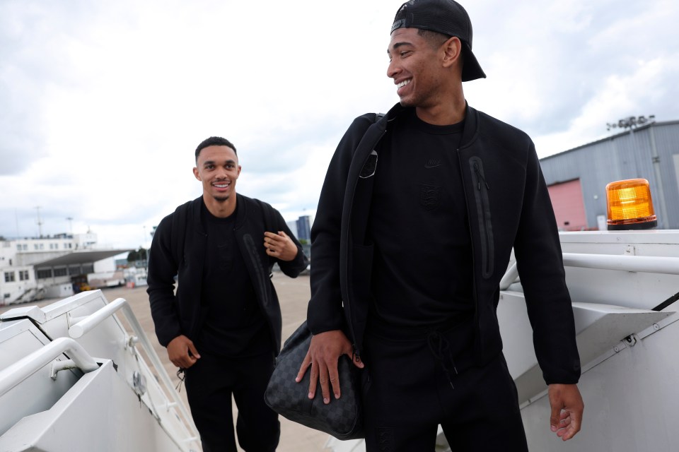 Trent Alexander-Arnold and Jude Bellingham boarding a plane at Birmingham Airport.