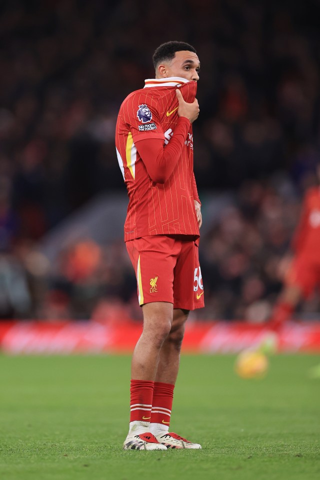 Trent Alexander-Arnold of Liverpool looking dejected on the pitch.