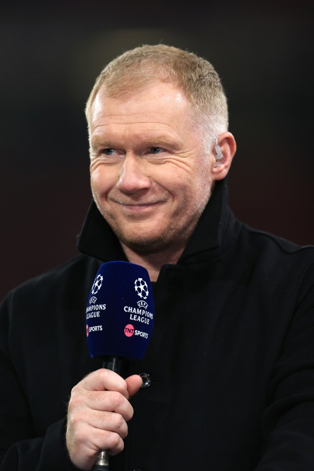 Paul Scholes, TV pundit, holding a UEFA Champions League microphone.