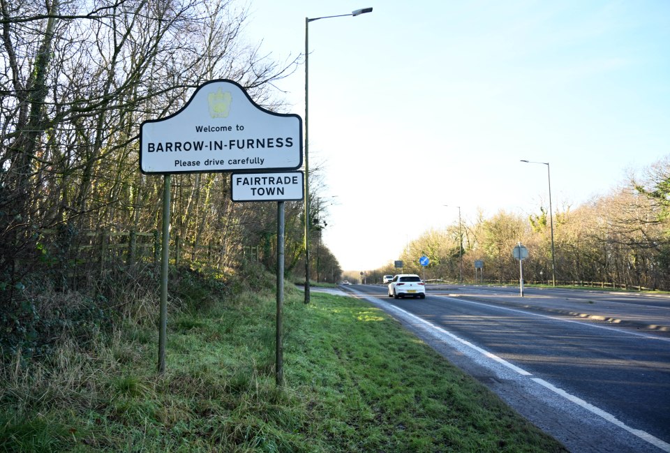 Welcome to Barrow-in-Furness Fairtrade Town sign on a roadside.