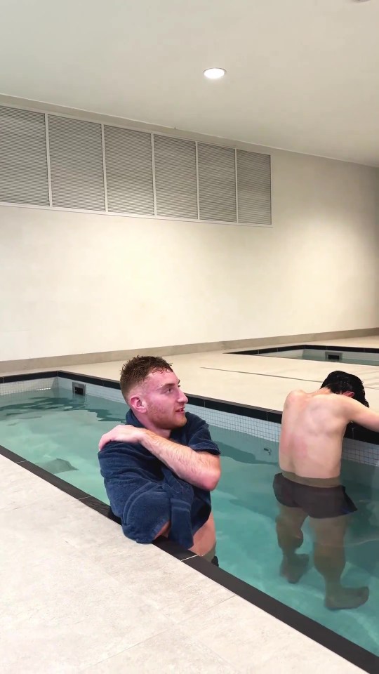 Two men in a pool.