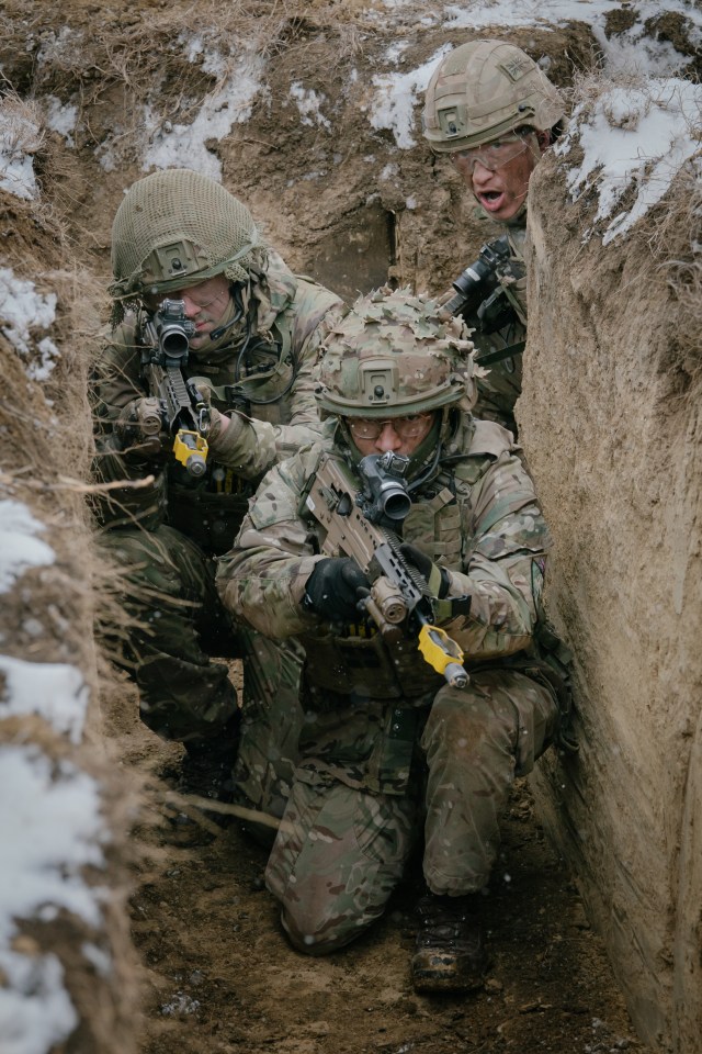 British soldiers in a trench during military exercise.