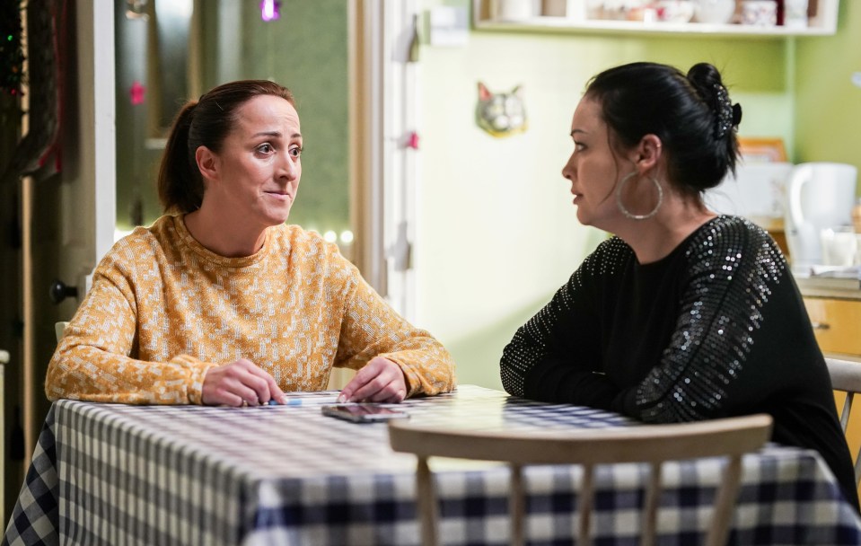 Sonia Fowler and Whitney Dean seated at a table, talking.