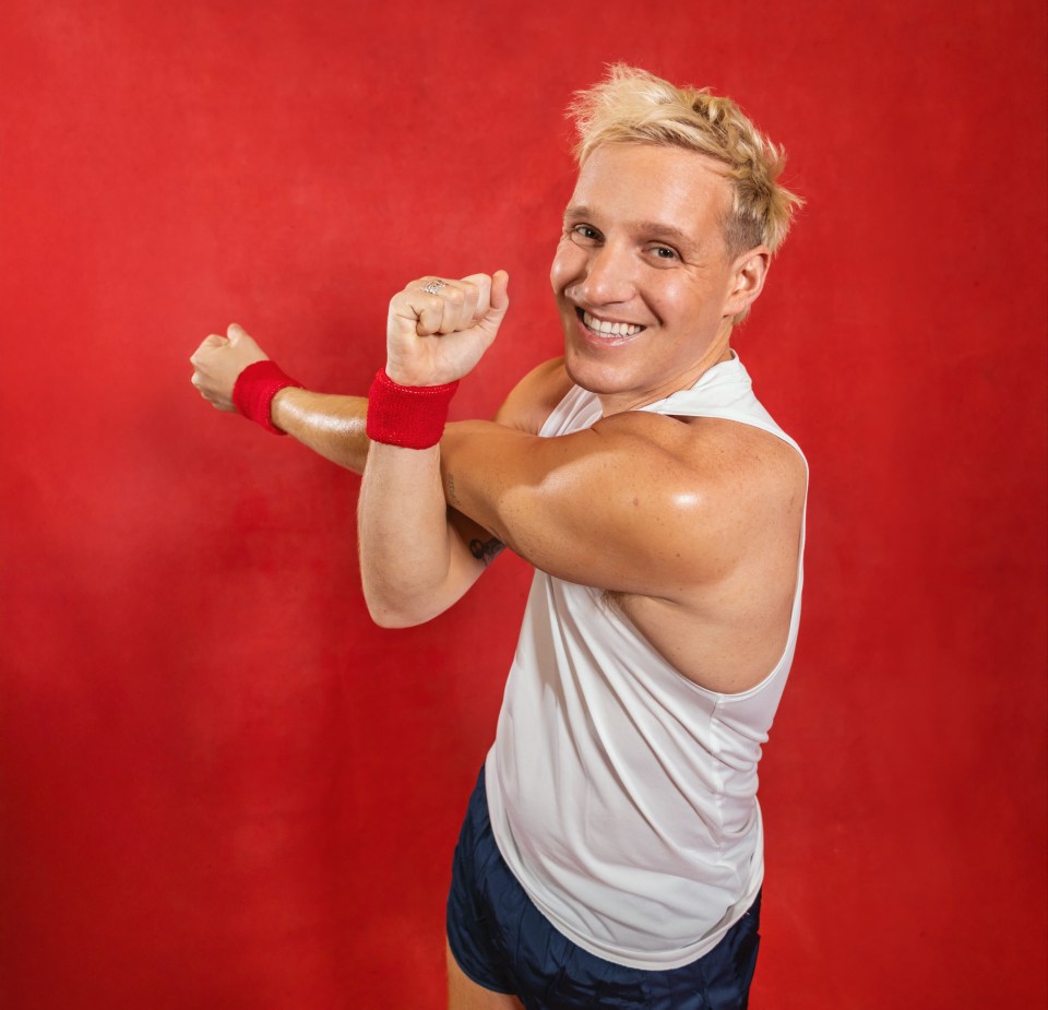 Jamie Laing stretching before a marathon for Red Nose Day.