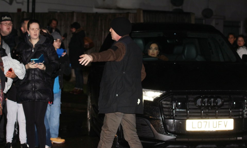 Jessie Wallace and Adam Woodyatt leaving a party with many fans waiting for autographs.