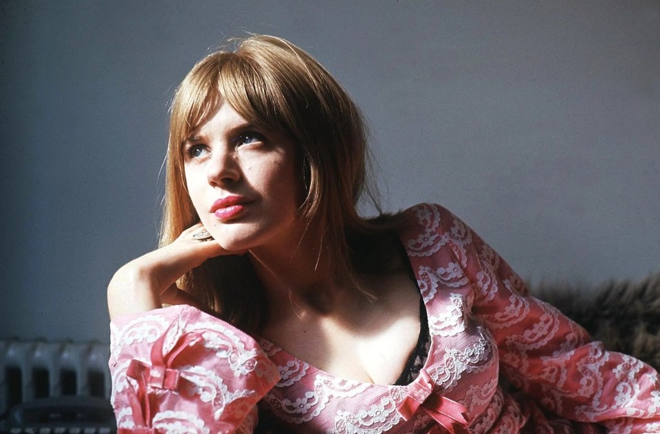 Photo of Marianne Faithfull in a pink lace dress.