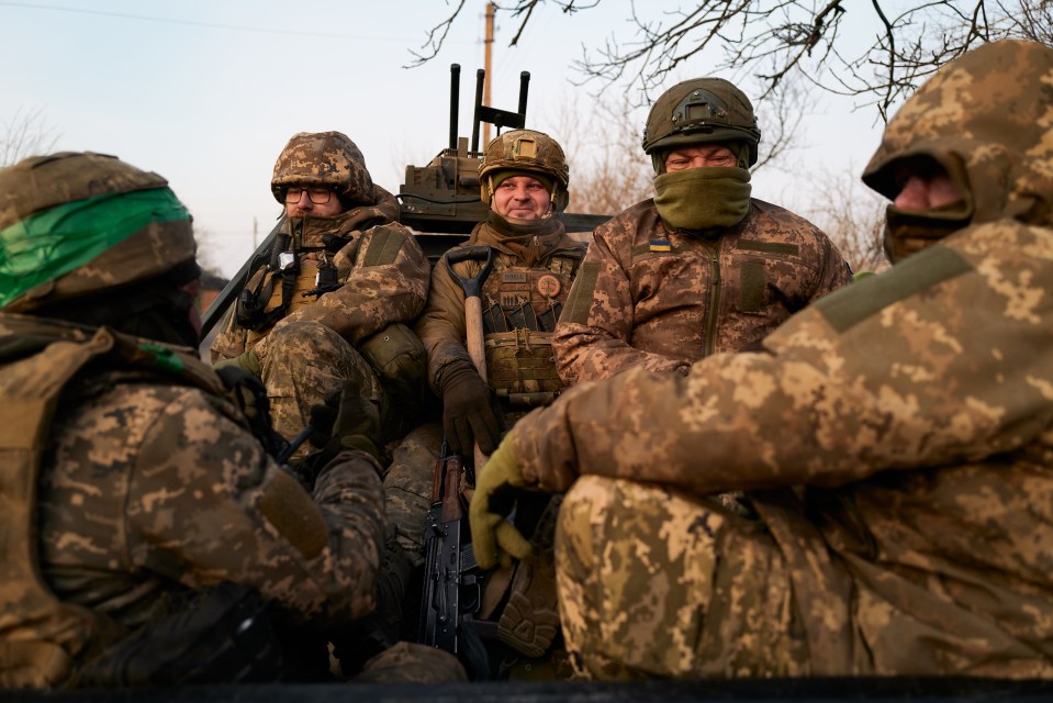 Ukrainian soldiers in a vehicle.