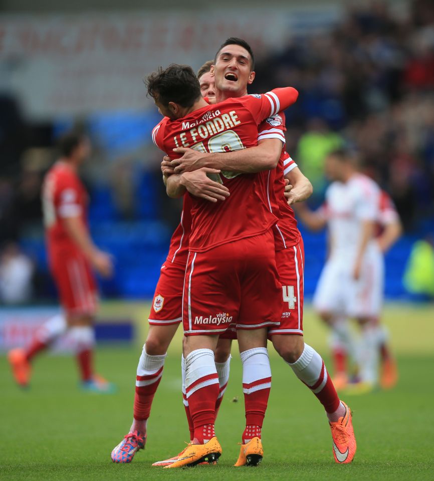 Cardiff City soccer players celebrating a goal.