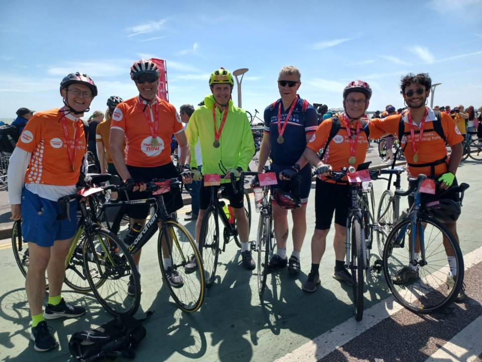 Six cyclists pose with their bikes after a ride to raise money for Meningitis Now.