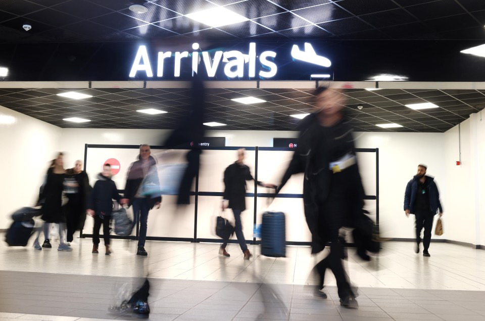 Passengers arriving at an airport.