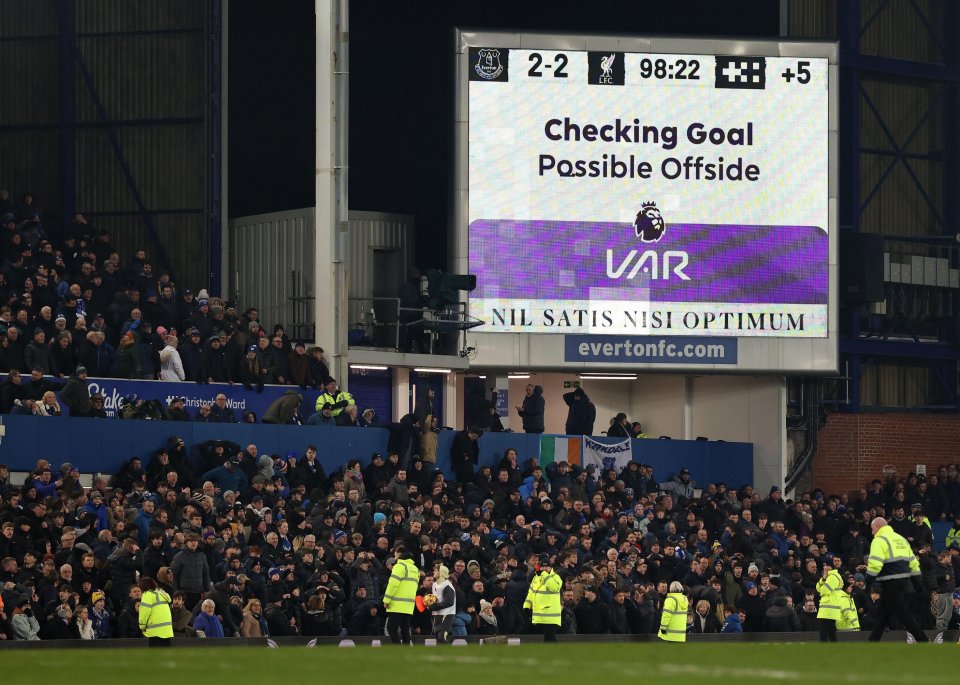 Stadium scoreboard showing VAR checking a possible offside goal.