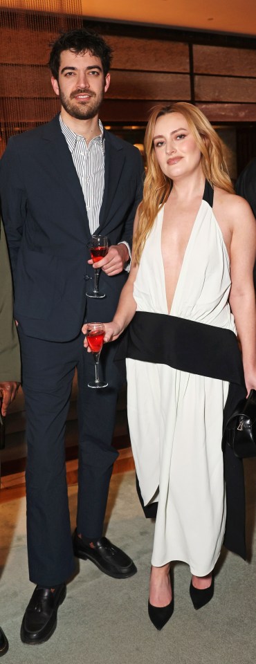 Four people at an awards party.