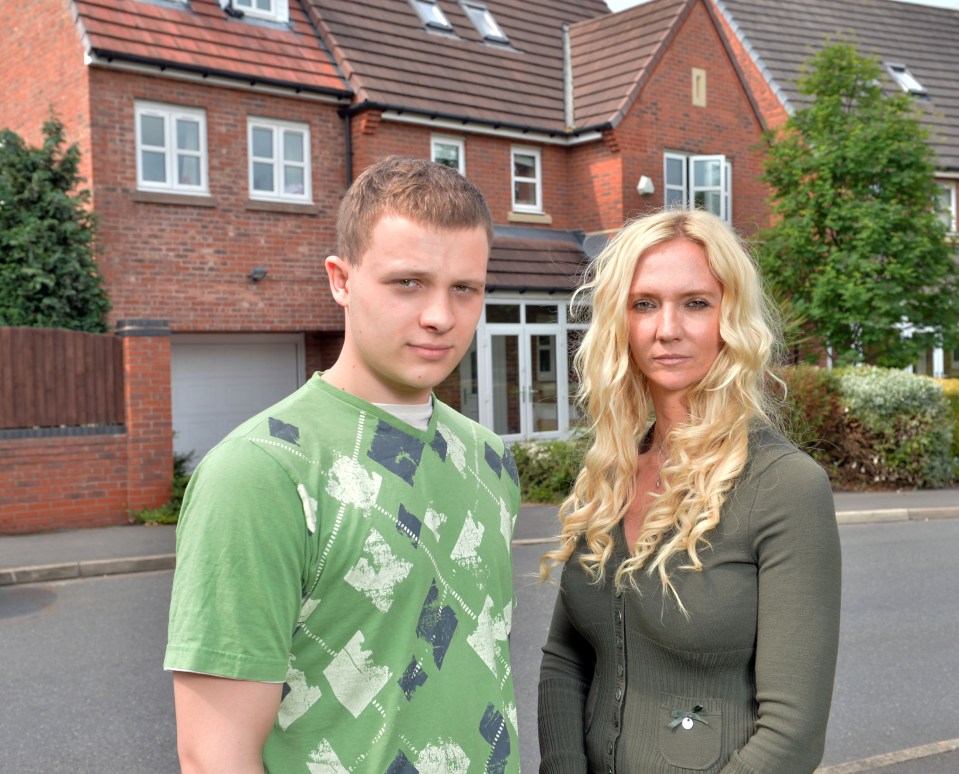 A woman and her teenage son stand outside their house after suffering carbon monoxide poisoning.
