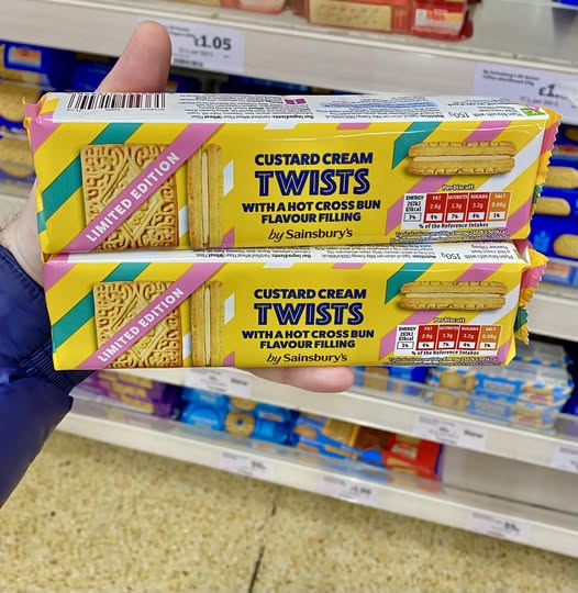 Two packages of Sainsbury's limited edition custard cream twists with hot cross bun flavor filling.