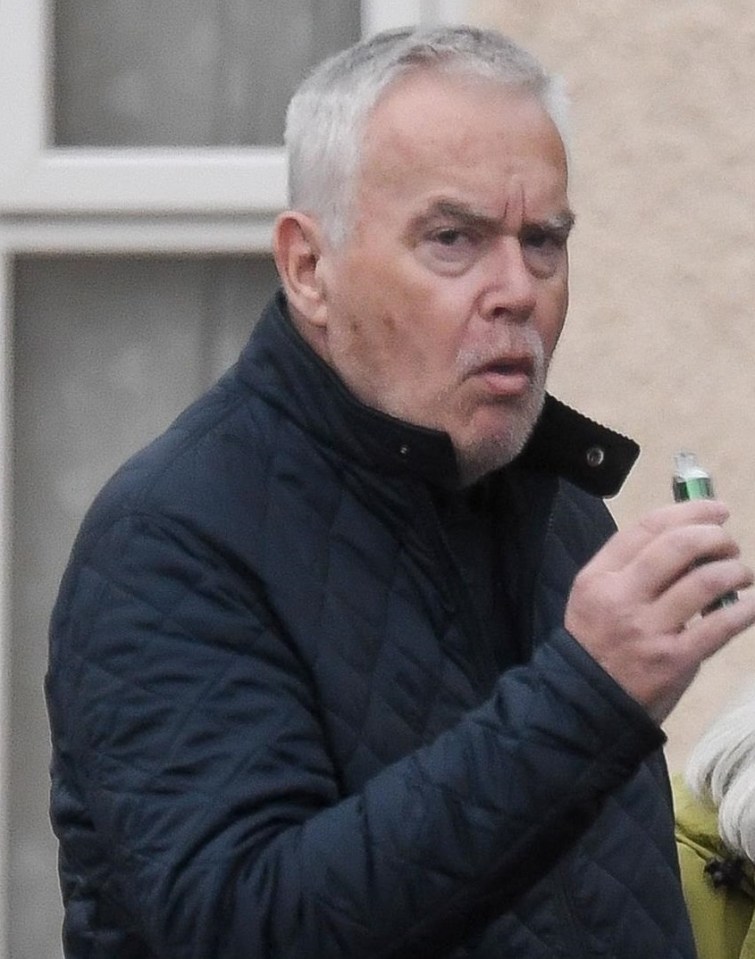 Huw Edwards walking with his mother.