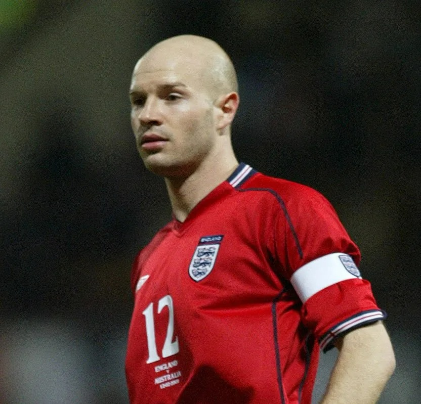 Danny Mills, England soccer player, wearing a red jersey.