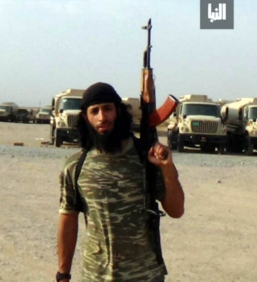 Photo of Mohammed Emwazi, also known as Jihadi John, in combat gear and carrying an AK-47.