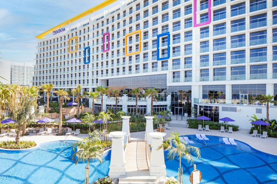 Centara Mirage Beach Resort Dubai with pool and bridge.