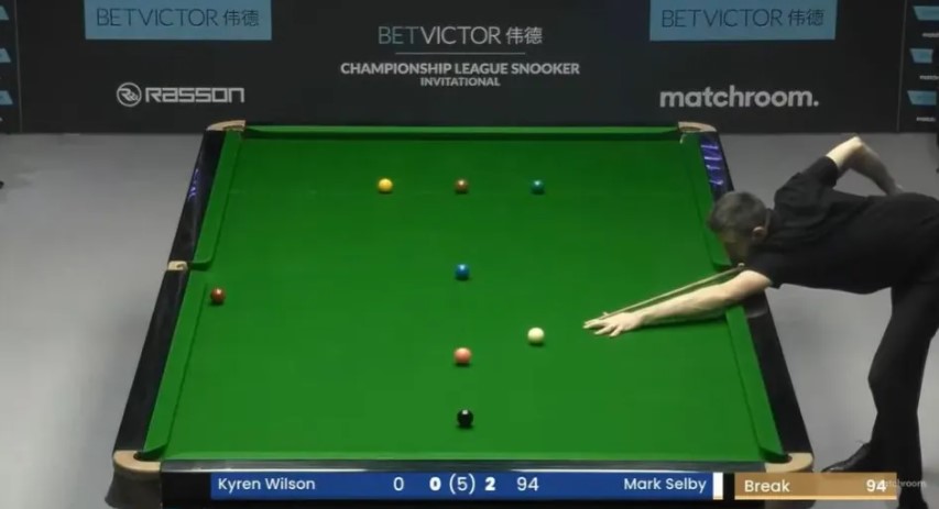 Snooker player taking a shot during a Championship League Snooker Invitational match.