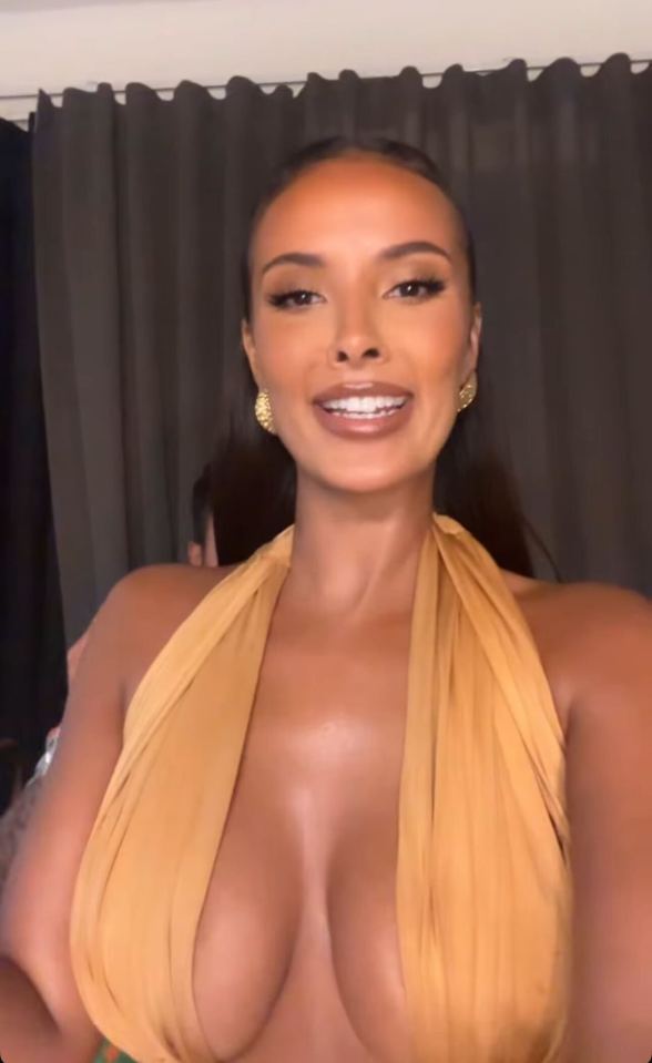Woman in a low-cut gold halter top.