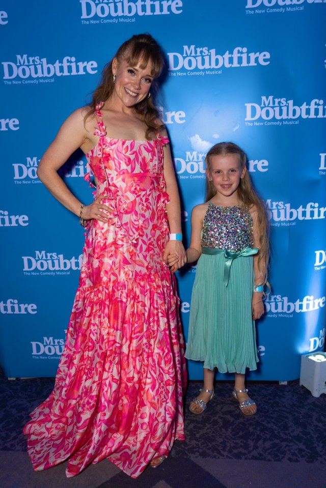 A woman and a girl at a Mrs. Doubtfire musical event.