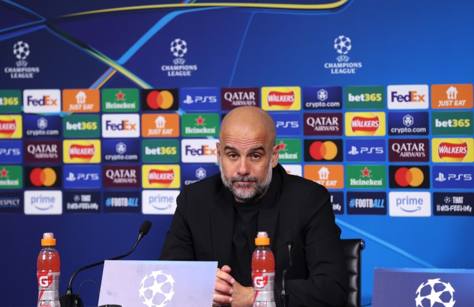 MANCHESTER, ENGLAND - FEBRUARY 11: Pep Guardiola, Manager of Manchester City, reacts as he speaks to the media in post match press conference during the UEFA Champions League 2024/25 League Knockout Play-off first leg match between Manchester City and Real Madrid C.F. at Manchester City Stadium on February 11, 2025 in Manchester, England. (Photo by Julian Finney - UEFA/UEFA via Getty Images)